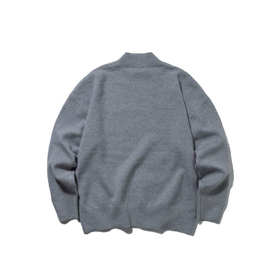 Back view of a gray mock-neck sweater laid flat on a white background.