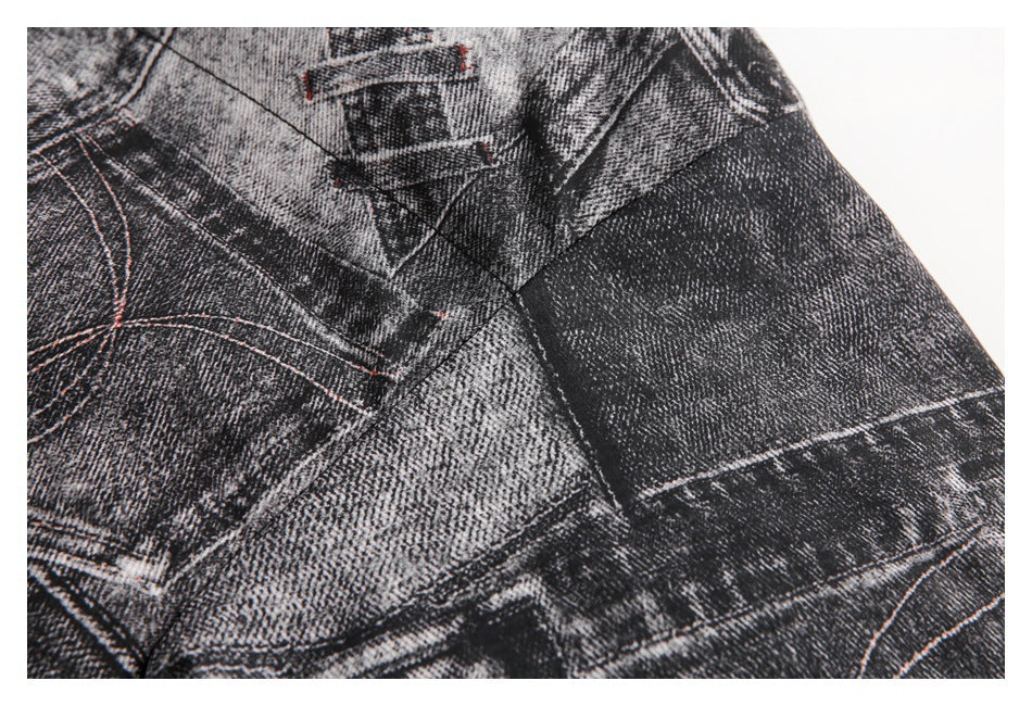 Close-up of the jacket's black and gray denim-print fabric, seams, and red contrast stitching.