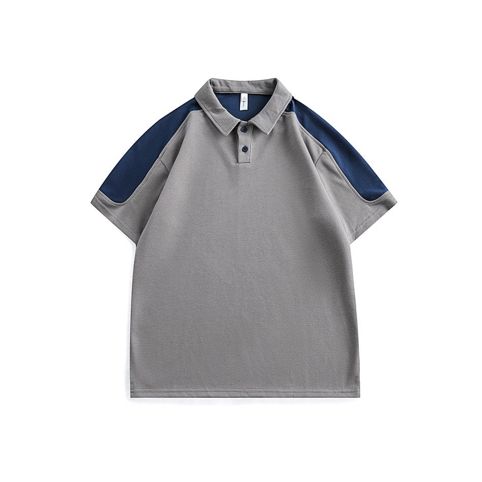 Gray short-sleeve polo shirt with navy shoulder and sleeve panels, navy collar underside and navy buttons, flat front view