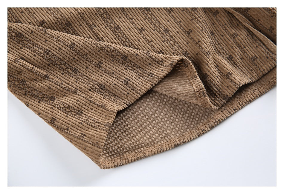 Close-up of the shirt's folded hem and inside seam against a white background.
