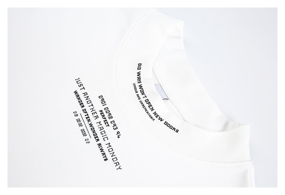 Close-up of a white crew-neck shirt with black English text printed around the collar and on the chest.