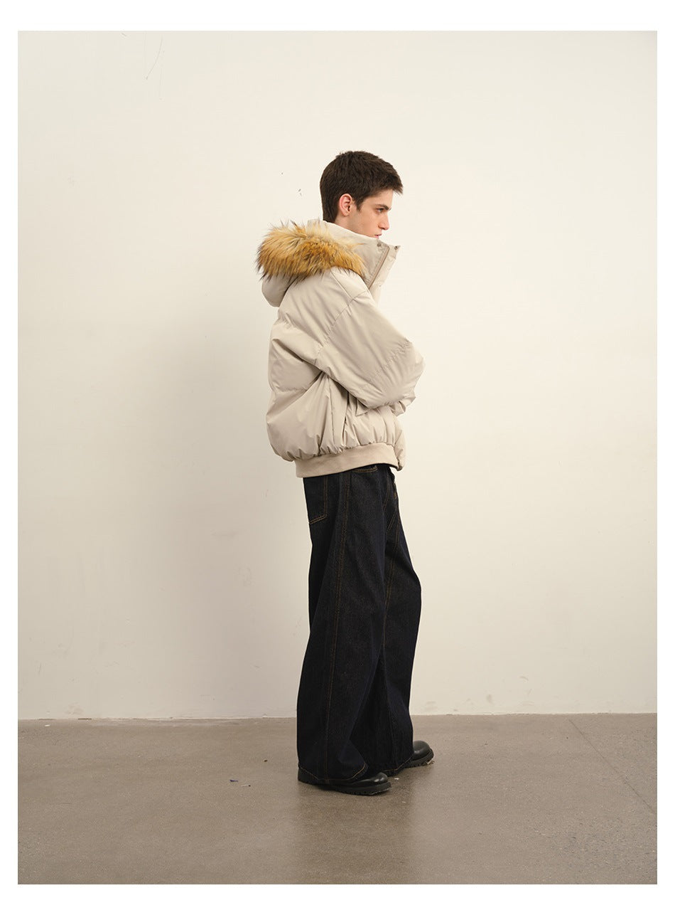 Side view of a man wearing a light beige puffer jacket with a tan fur-trimmed hood.