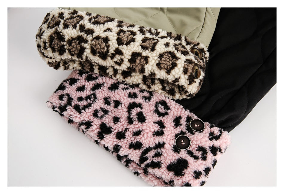 Close-up of leopard-print fleece cuffs in cream and pink, shown folded over olive and black pants.