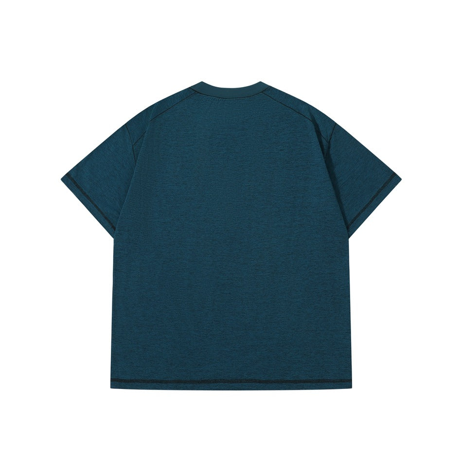Back view of a teal heather short-sleeve crew-neck T-shirt with raglan seams and dark stitching.