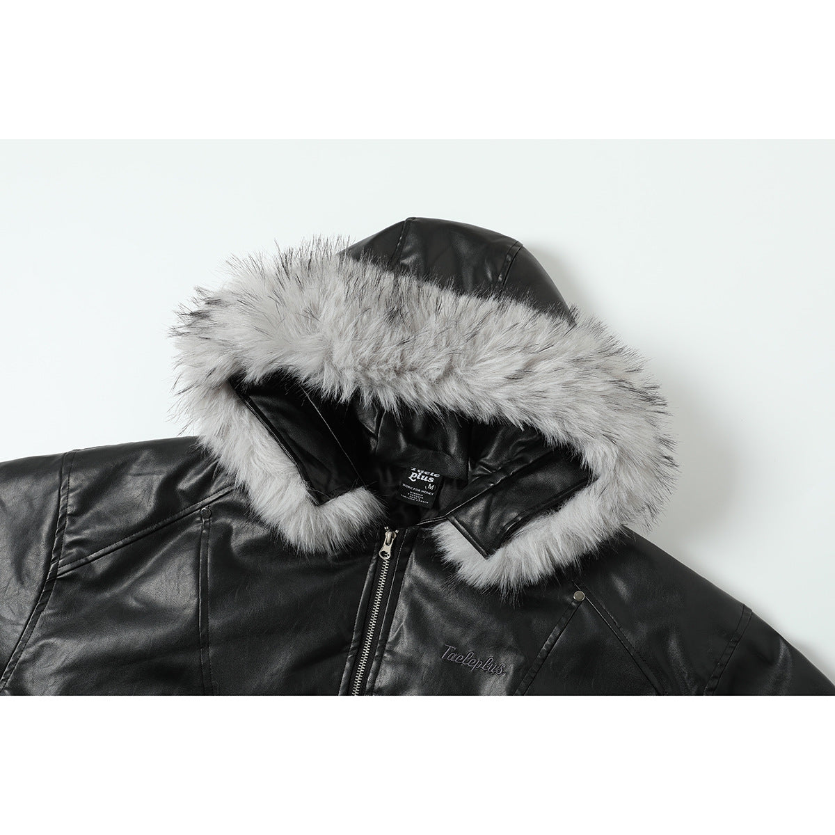 Front view of a black hooded jacket with gray fur trim, a front zipper, and stitched chest lettering.