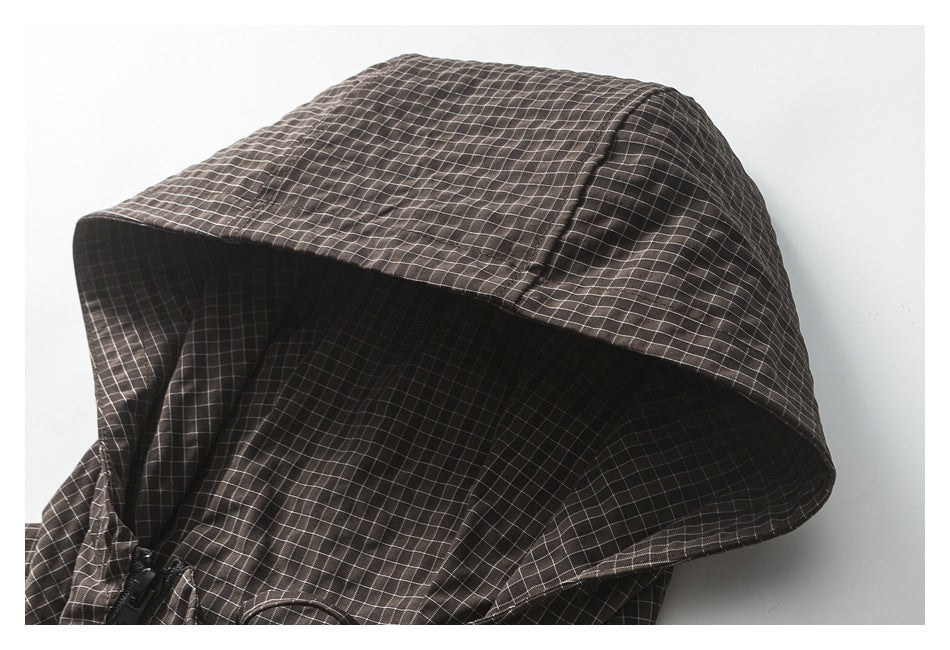Close-up of the dark brown grid-pattern jacket's hood and its interior.