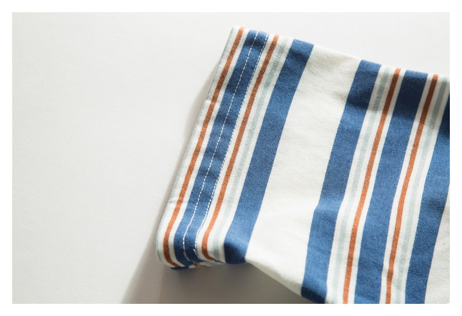 Close-up of the striped T-shirt sleeve edge with visible stitching.