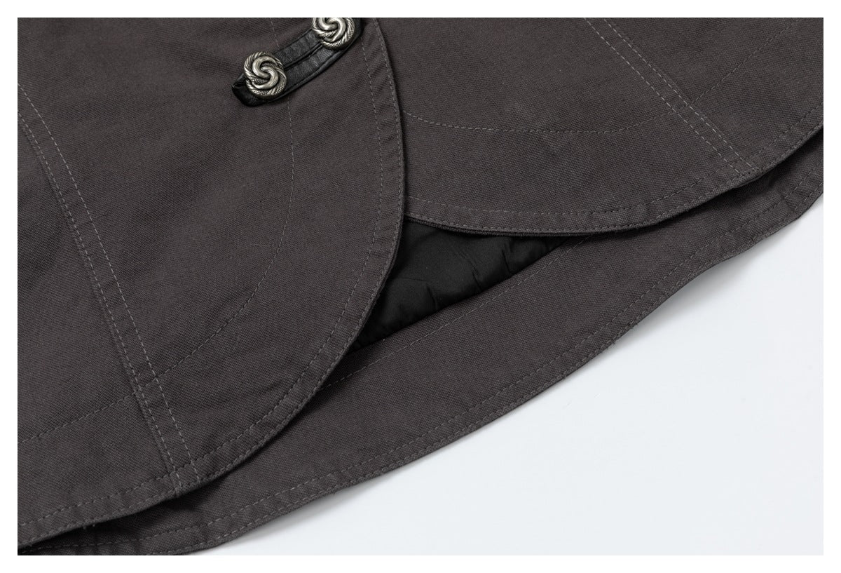 Close-up of the charcoal jacket's curved, stitched hem and dark inner lining.