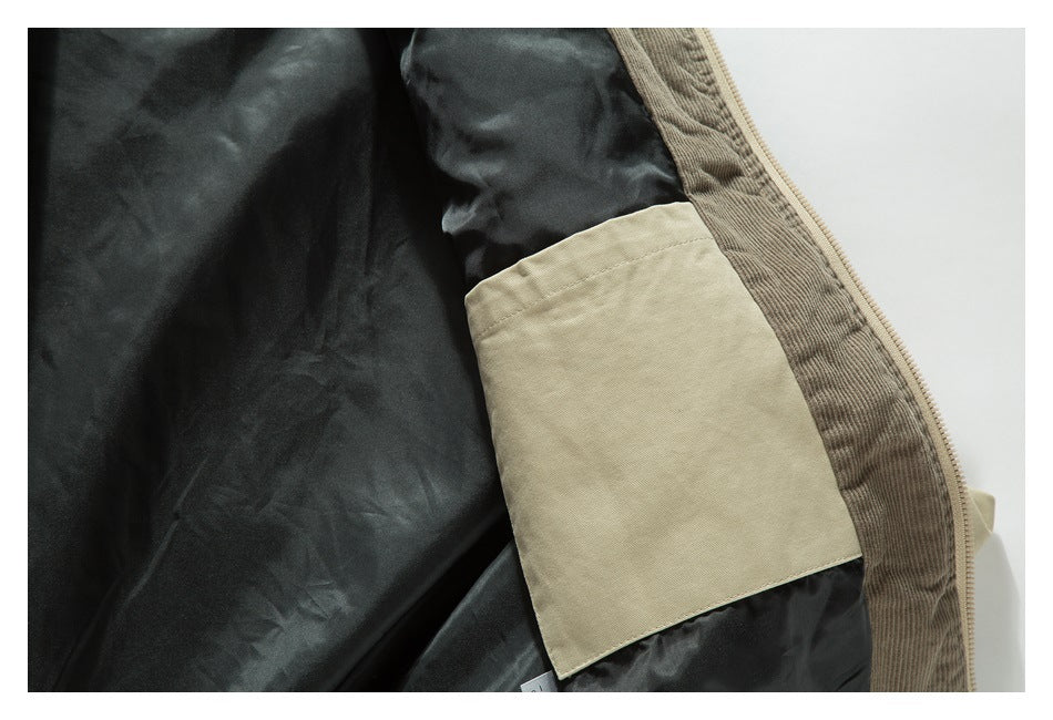 Close-up of the tan inner pocket, black lining, and jacket zipper.