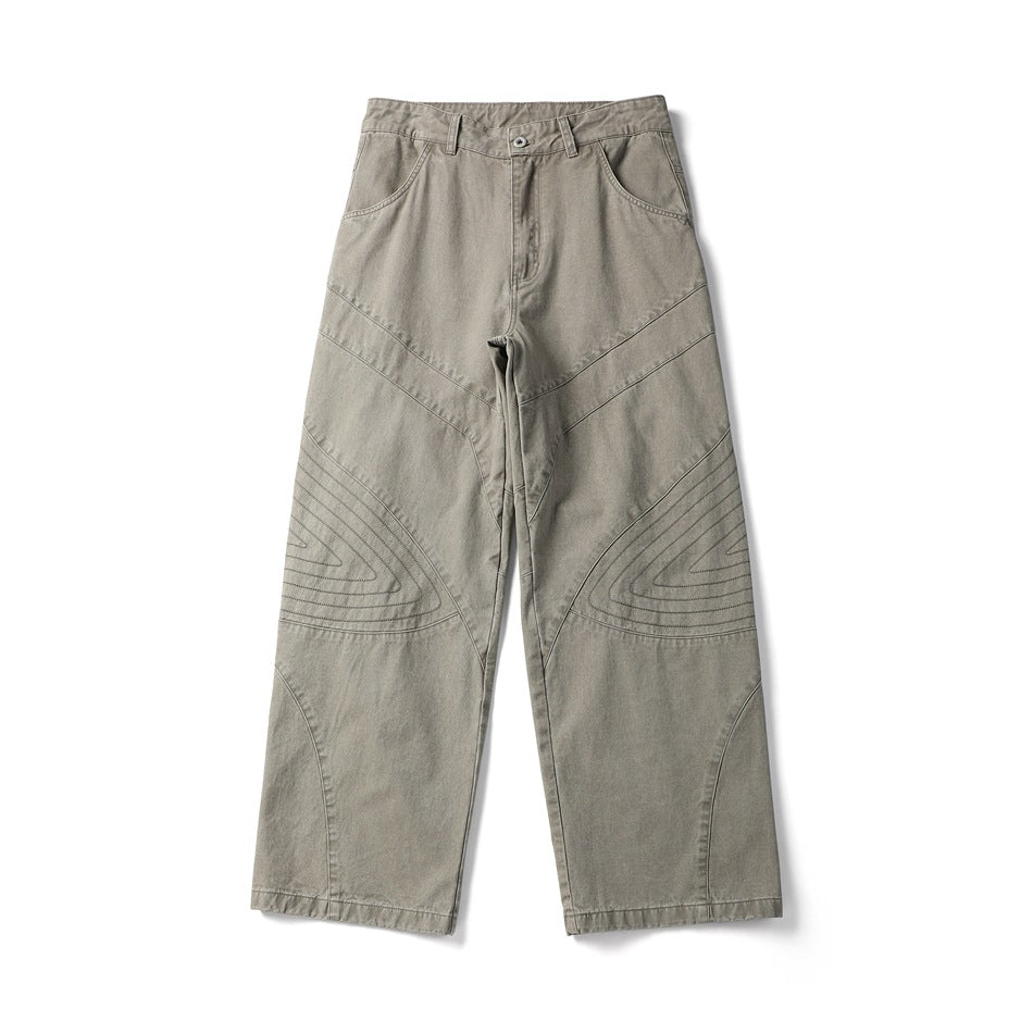 Light khaki wide-leg pants flat lay, front view, with paneled seams and concentric stitching at the knees