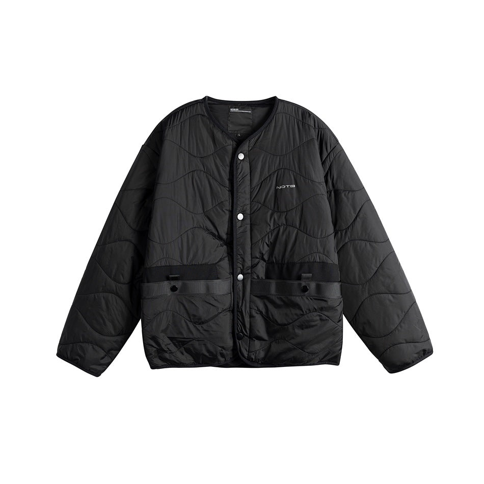 Black quilted collarless jacket, front view, snap-button closure and black waist pocket straps