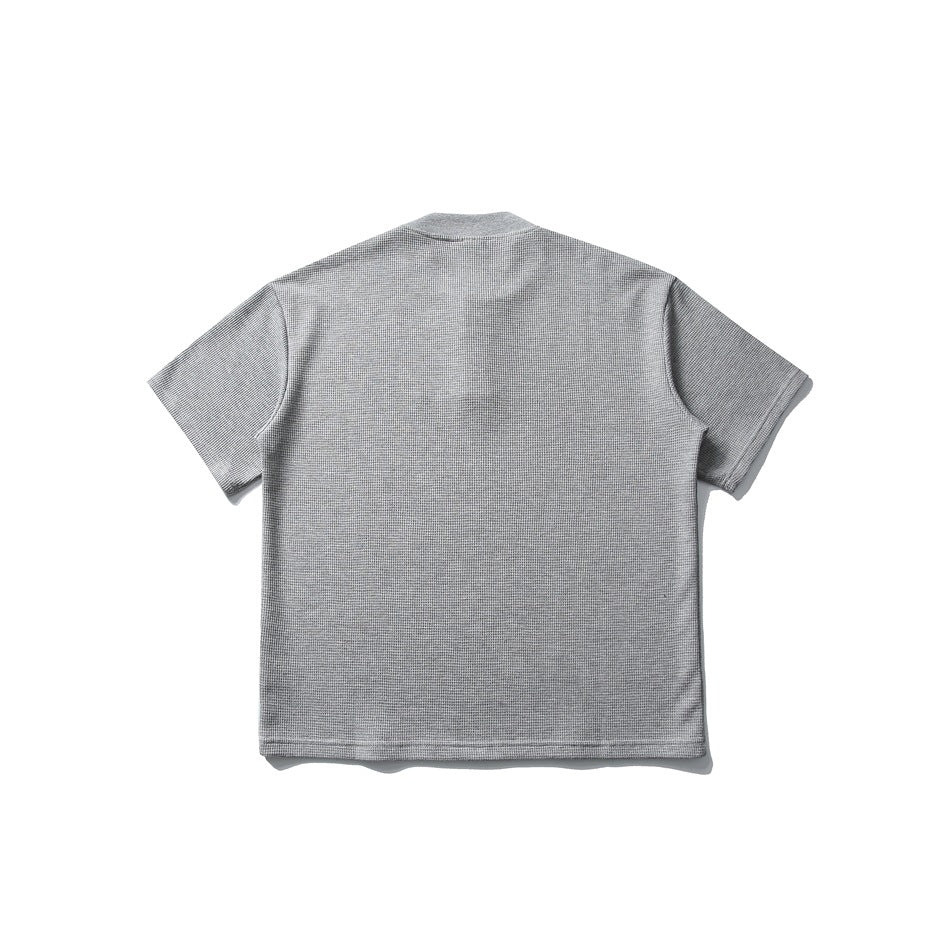Back view of a light gray short-sleeve textured shirt with a plain design.