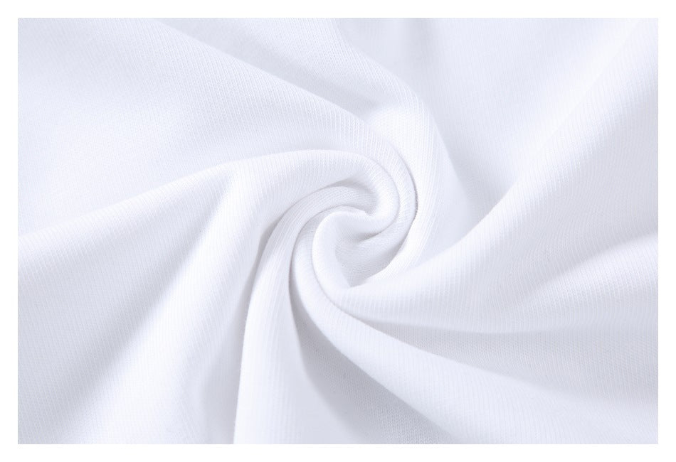 Close-up of plain white fabric gathered into a spiral to show its texture.