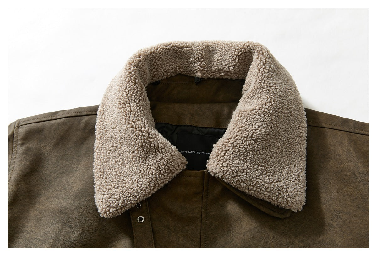 Close-up of the brown jacket’s wide collar, faced with cream curly fleece.