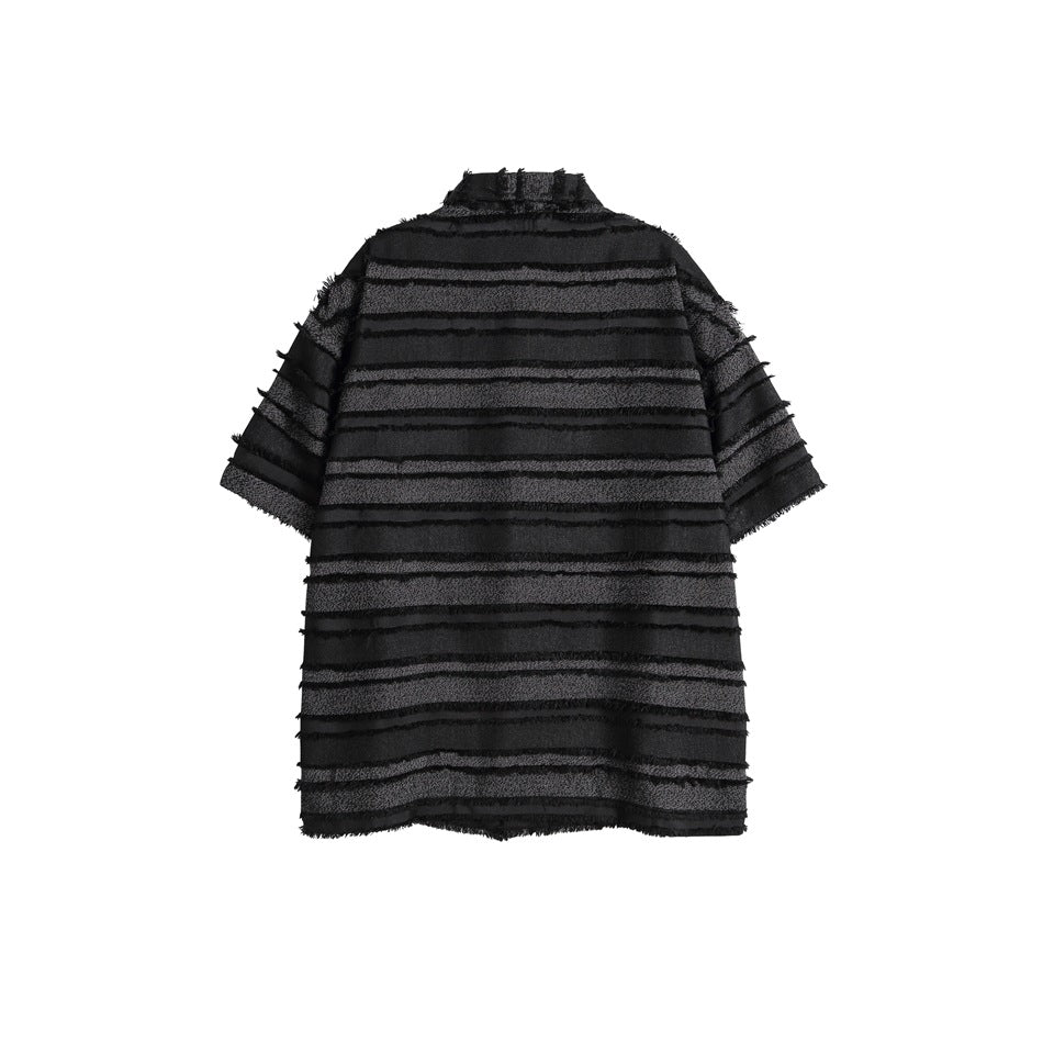 Back view of a black short-sleeve shirt with horizontal textured stripes and frayed edges.