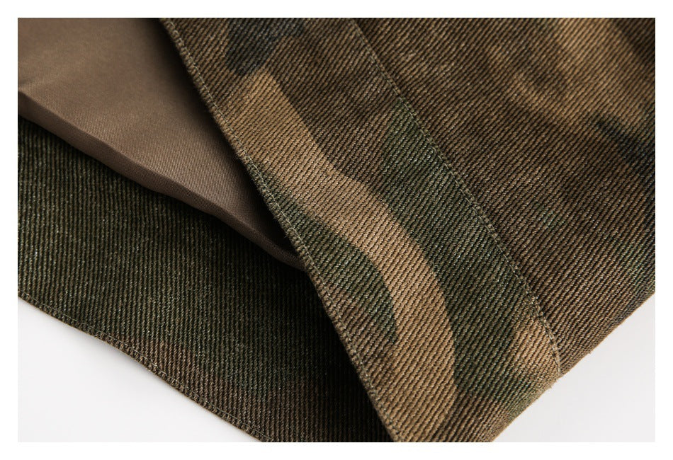 Close-up showing the folded edge and smooth brown lining of a camouflage garment.