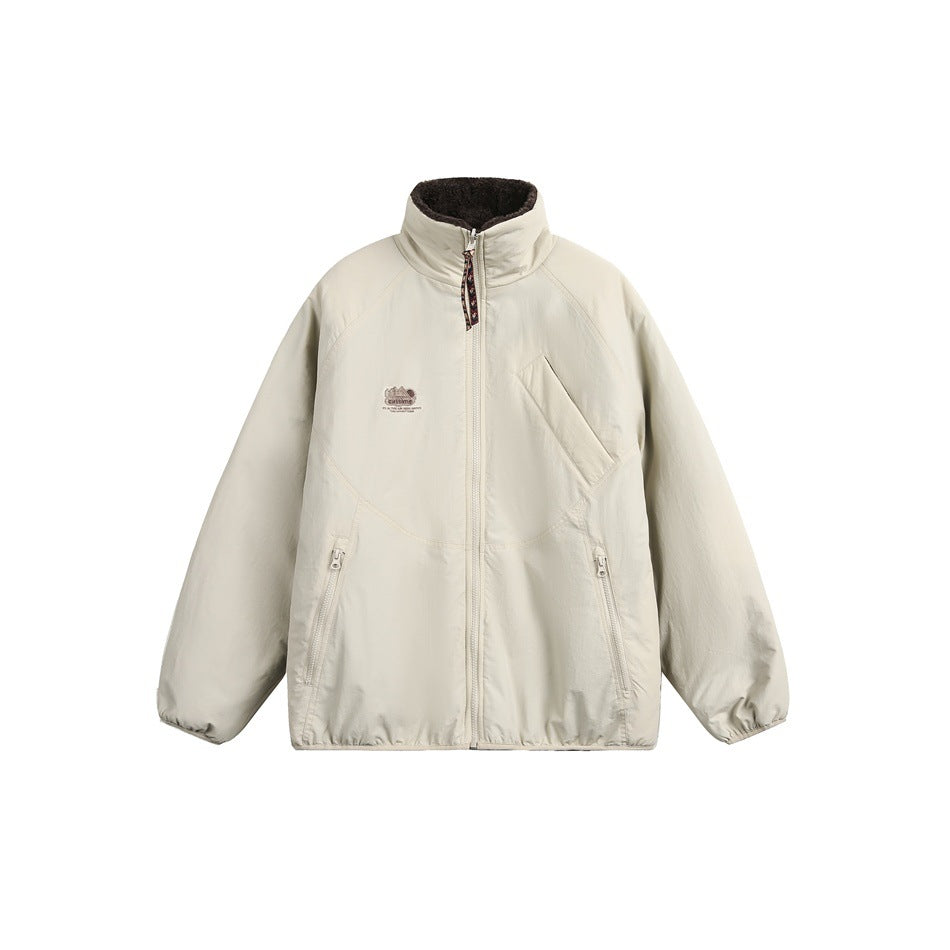 Front view of an ivory zip jacket with a high collar, angled chest pocket, and two zippered hand pockets.