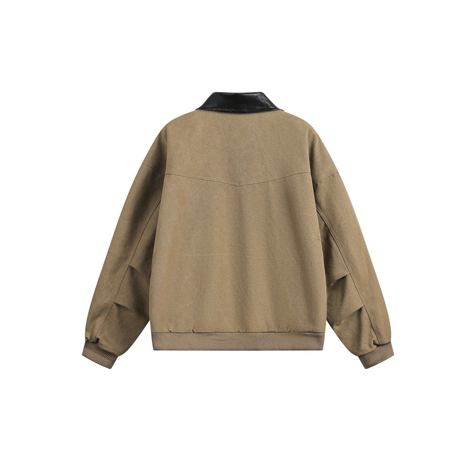 Back view of a tan zip-up jacket with a black collar, long sleeves, and ribbed cuffs and hem.