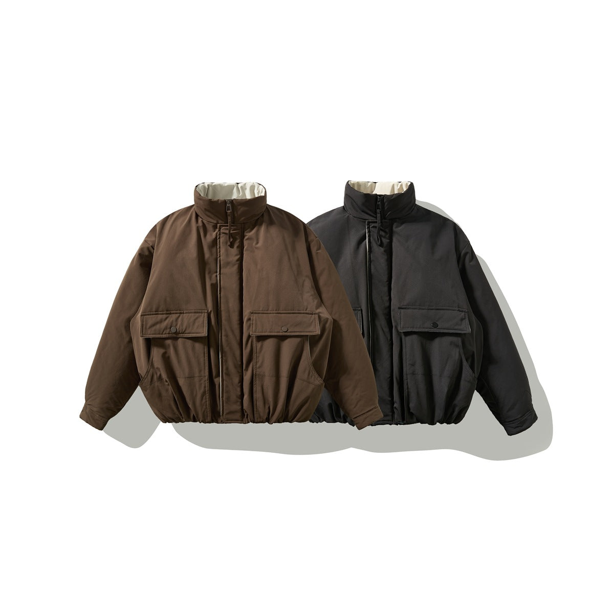 Brown and black high-collar jackets shown from the front, each with a zipper and two flap pockets.