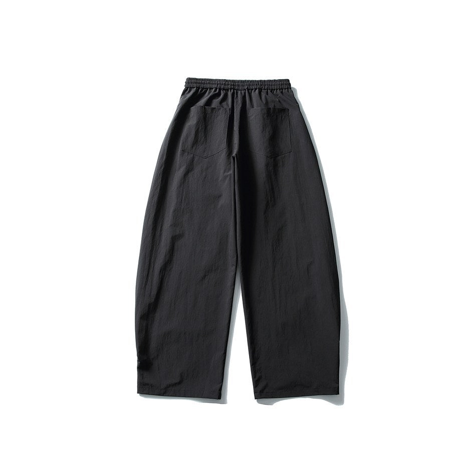Black wide-leg pants, back flat lay, showing elastic waistband and two patch back pockets