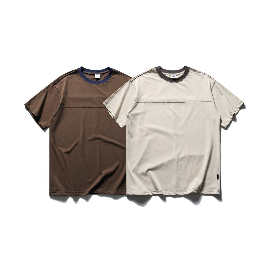 Two short-sleeve T-shirts shown from the front: one brown with a navy collar and one light beige with a dark collar.