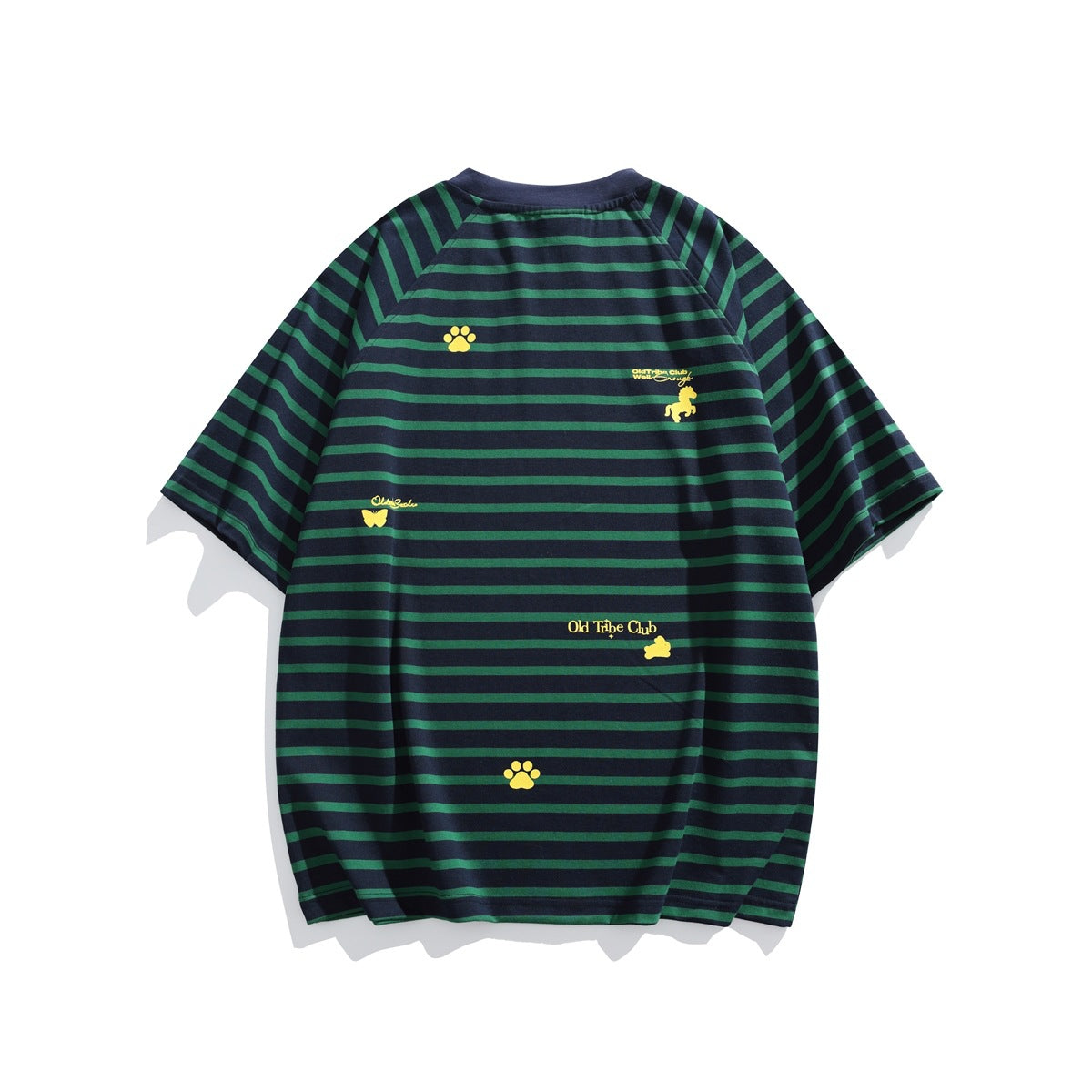 Flat-lay view of a navy short-sleeve shirt with green horizontal stripes and scattered yellow paw, animal and text motifs.