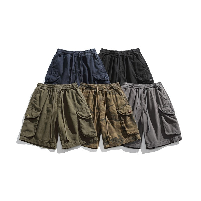 Five pairs of cargo shorts arranged together in navy, black, olive, camouflage, and gray.