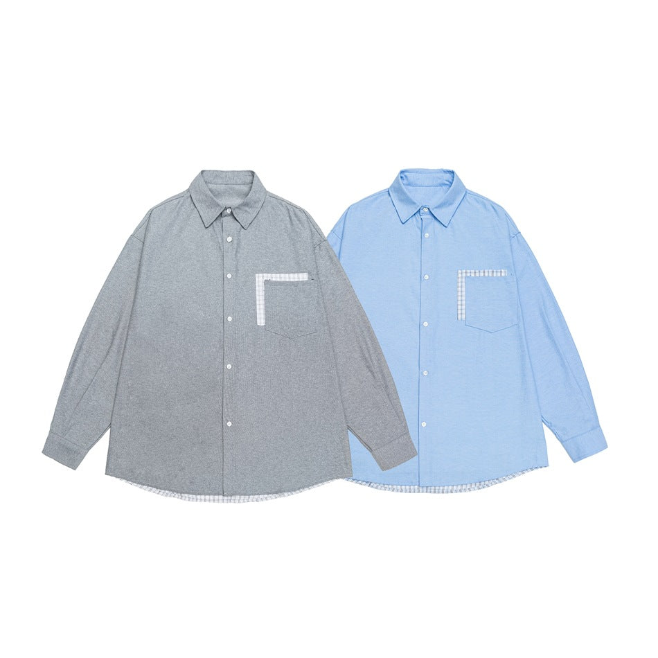 Two long-sleeved button-up shirts, one gray and one light blue, each with checked trim on the chest pocket.