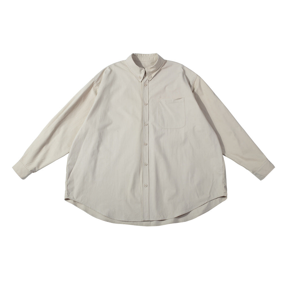 Light khaki oversized long-sleeve button-down shirt with chest pocket, flat lay on white background