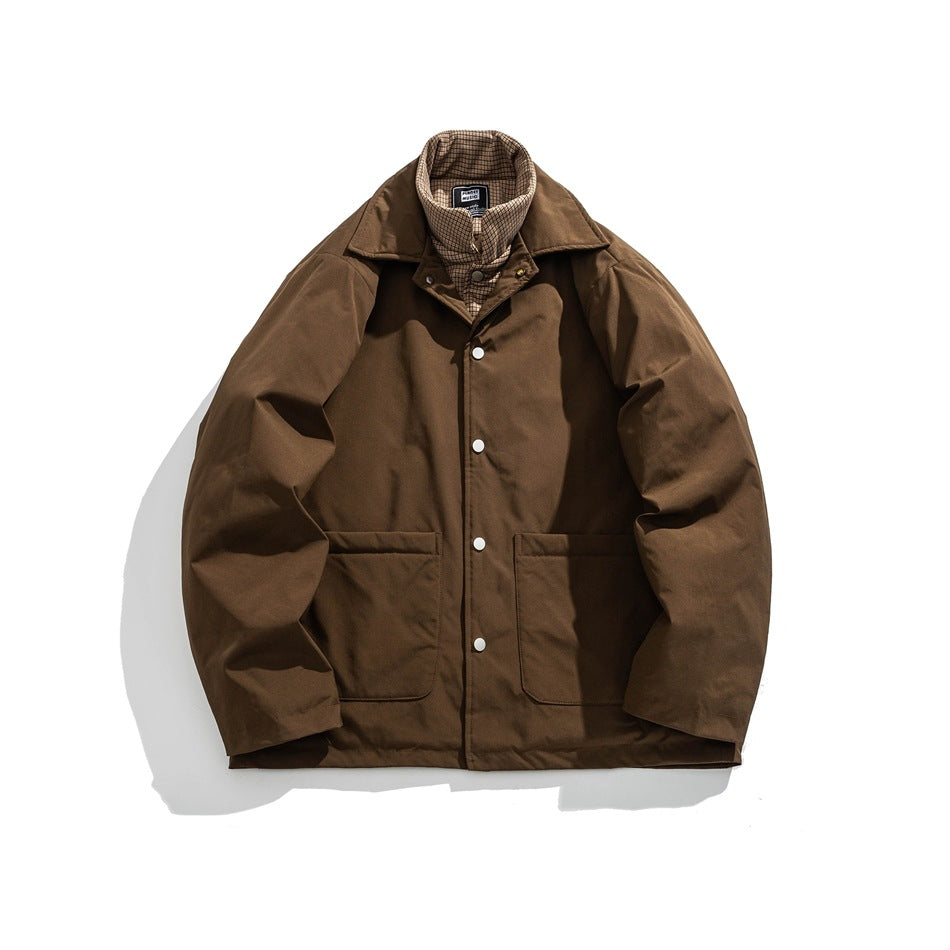 Brown button-front jacket with wide collar, two patch pockets and plaid inner collar layer, flat lay