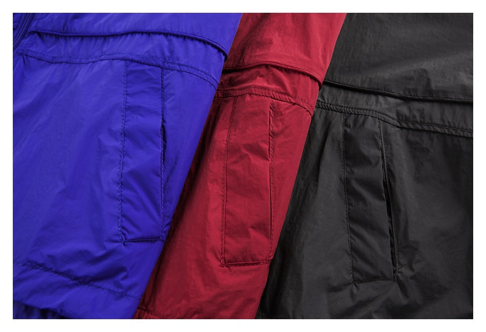 Close-up of pocket details on blue, red, and black jackets arranged side by side.