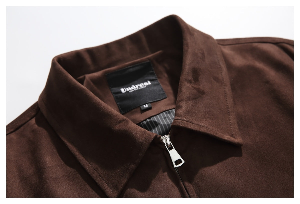 Close-up of the jacket's collar, zipper pull, striped inner lining and sewn neck label.