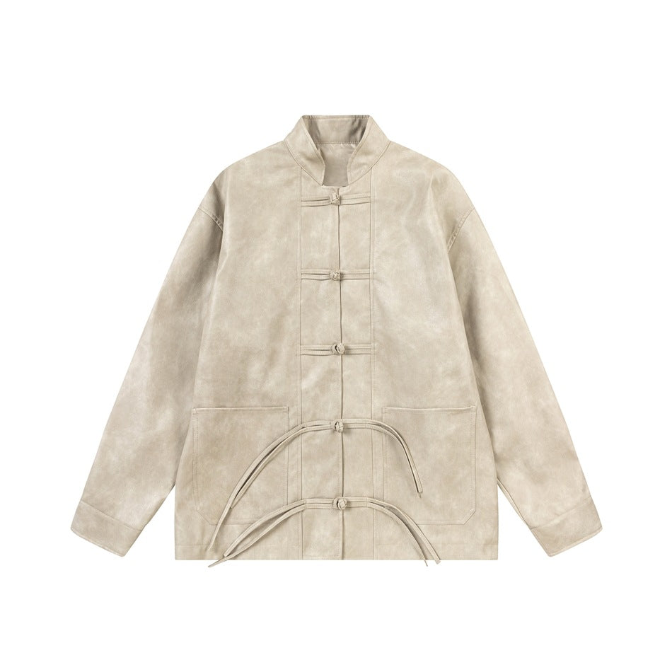 Beige stand-collar faux leather jacket with knotted frog buttons, patch pockets and tassel ties, flat lay front view