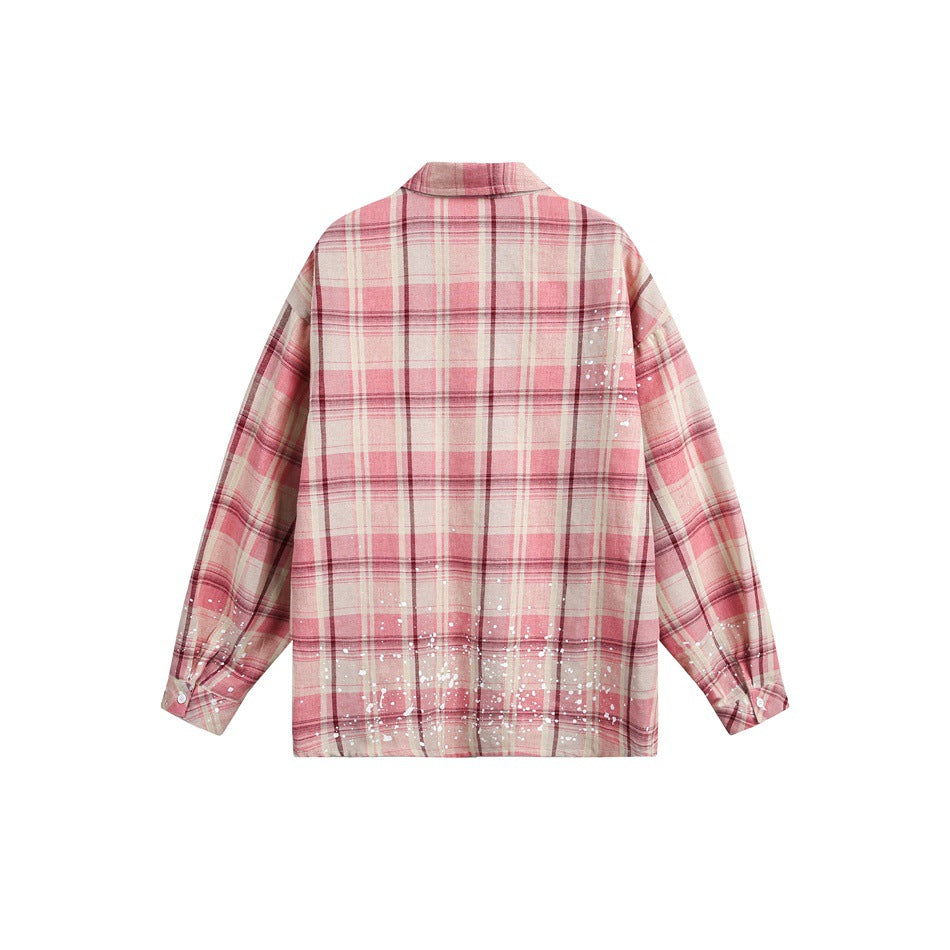 Back view of a pink plaid button-up shirt with white splatter details on a white background.