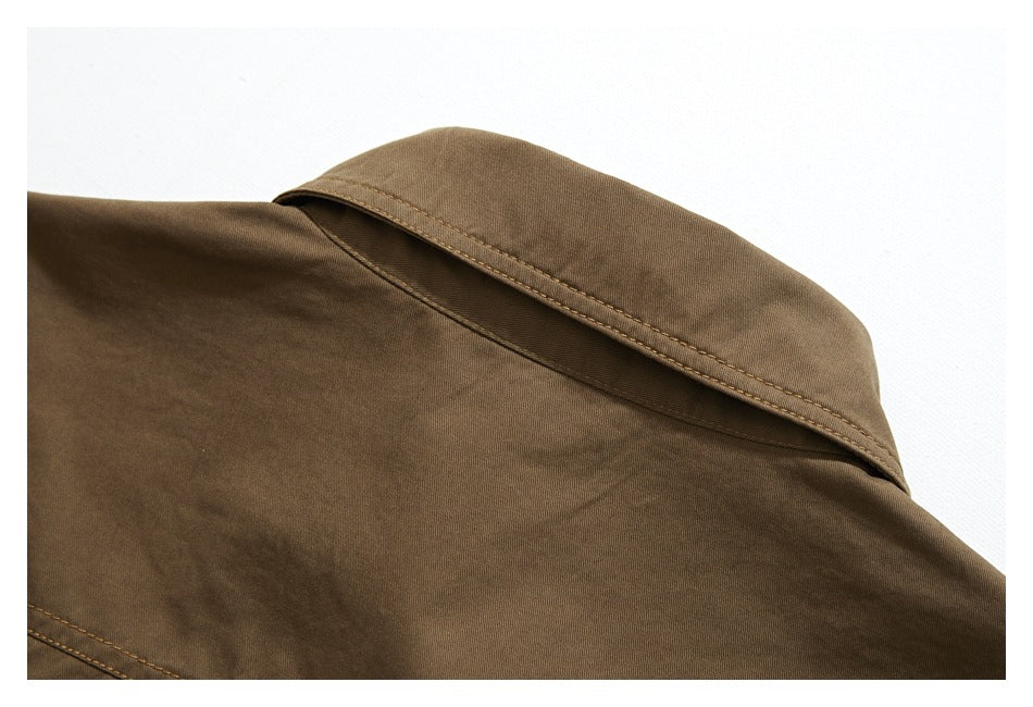 Close-up of a brown garment collar with visible double stitching.