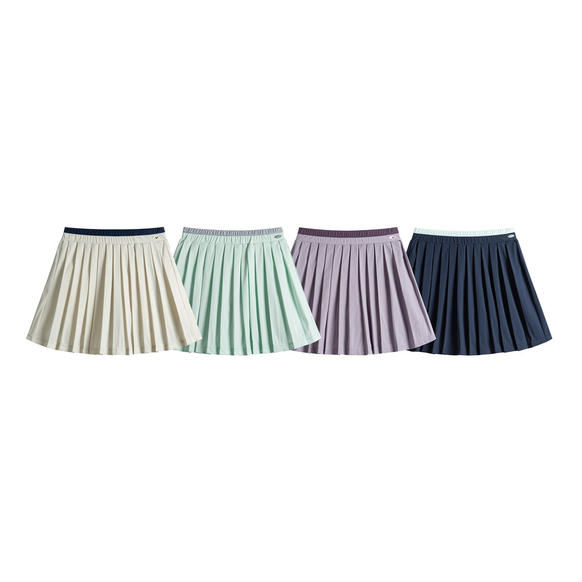 Four pleated skirts shown in cream, mint, lavender, and navy colorways.