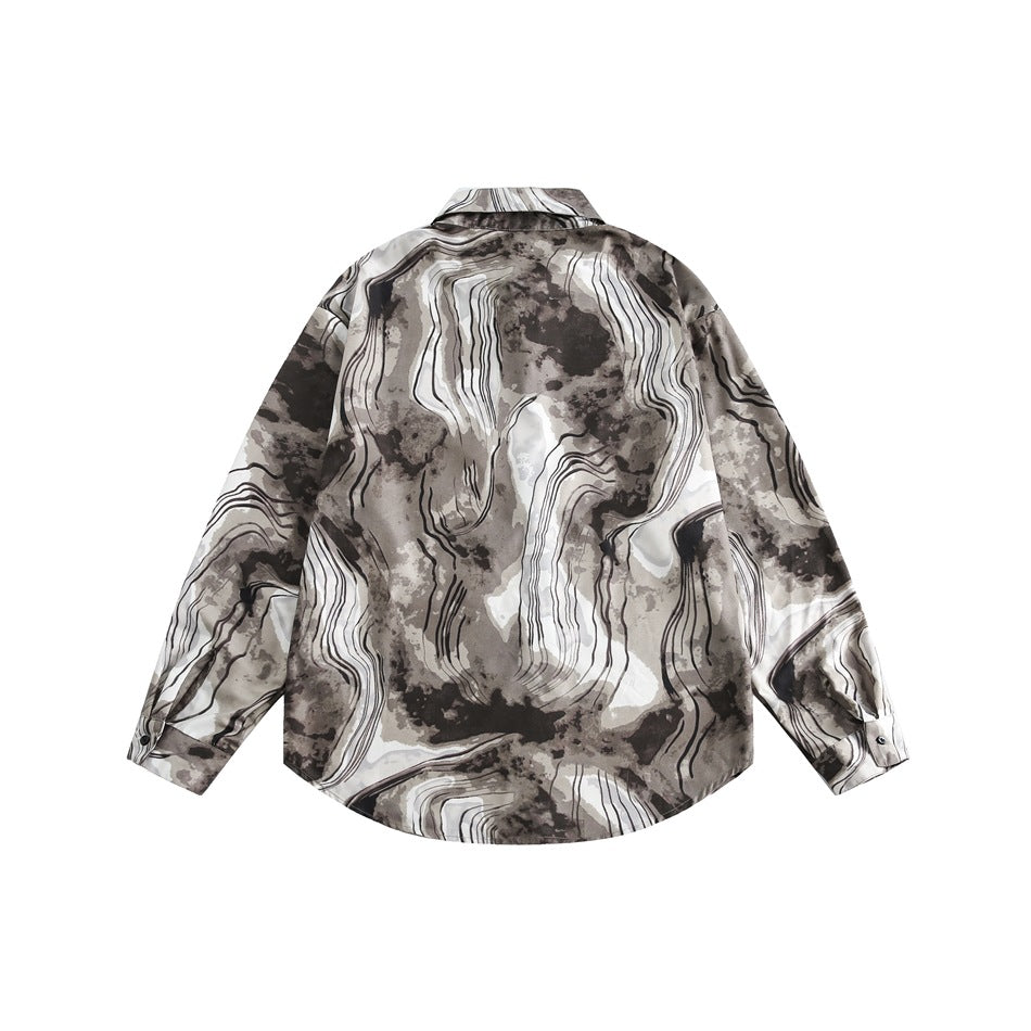Back view of a long-sleeved taupe, brown, and ivory abstract-print shirt on a white background.