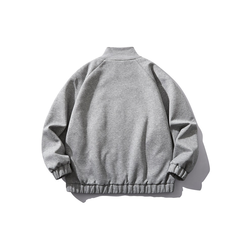 Back view of a gray jacket with a stand collar, raglan sleeves, and gathered cuffs and hem.
