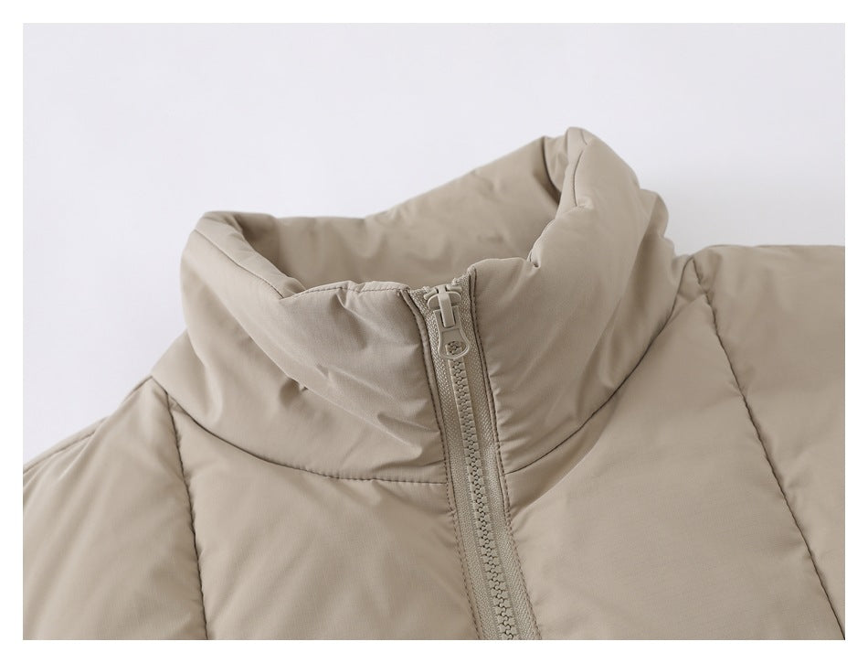 Close-up of the taupe jacket's high collar and front zipper.