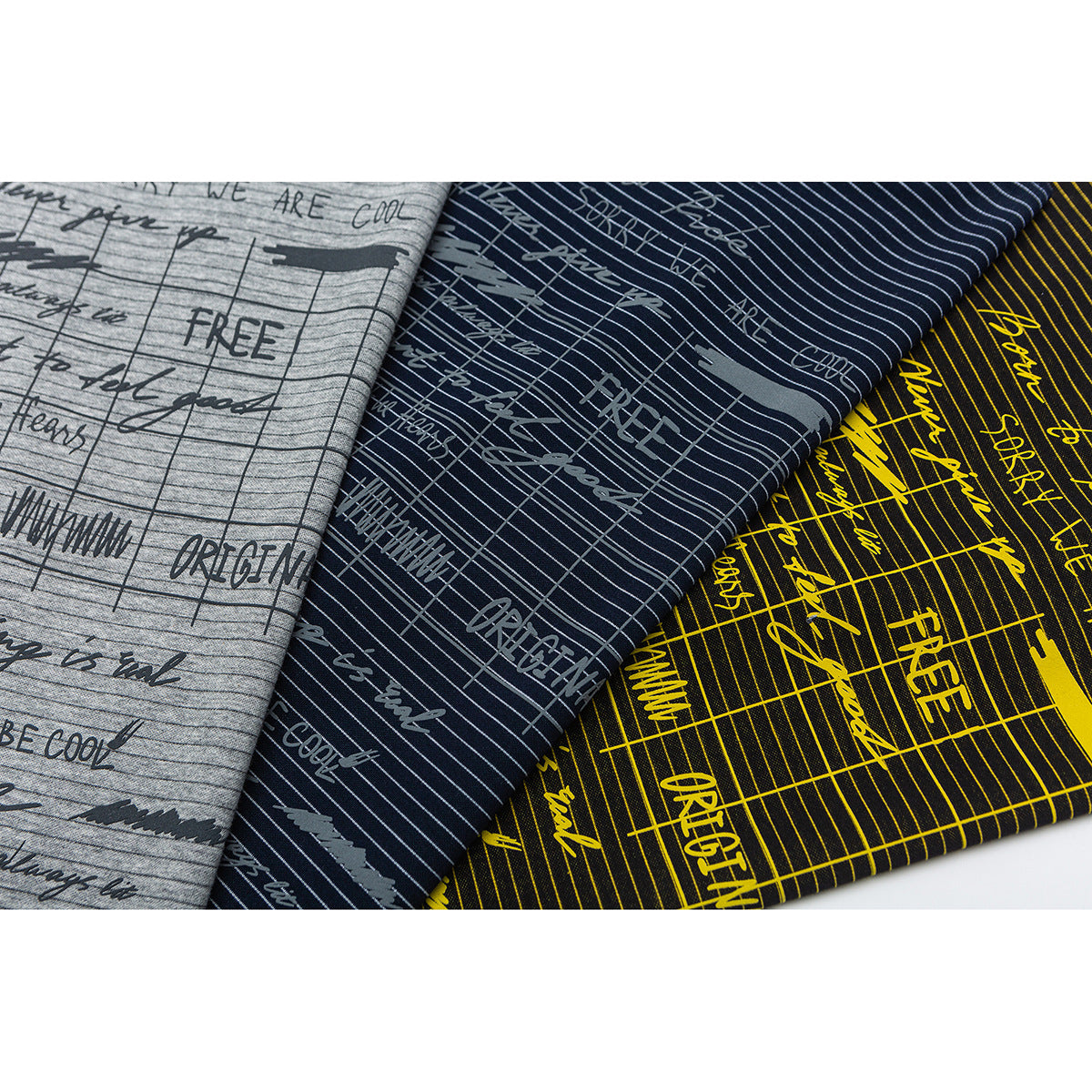 Three folded fabrics in gray, navy, and black with narrow stripes and printed English lettering.