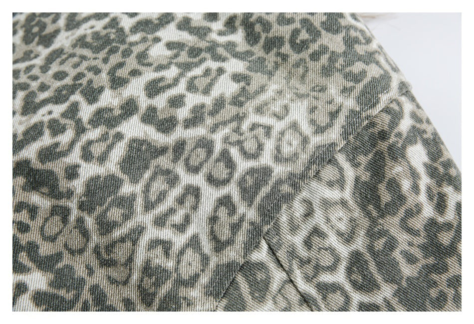 Close-up of the jacket's muted animal-print fabric and a stitched seam.