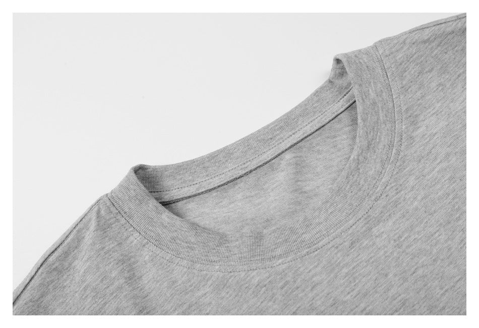 Close-up of the heather gray T-shirt's ribbed crew neckline and shoulder seam.