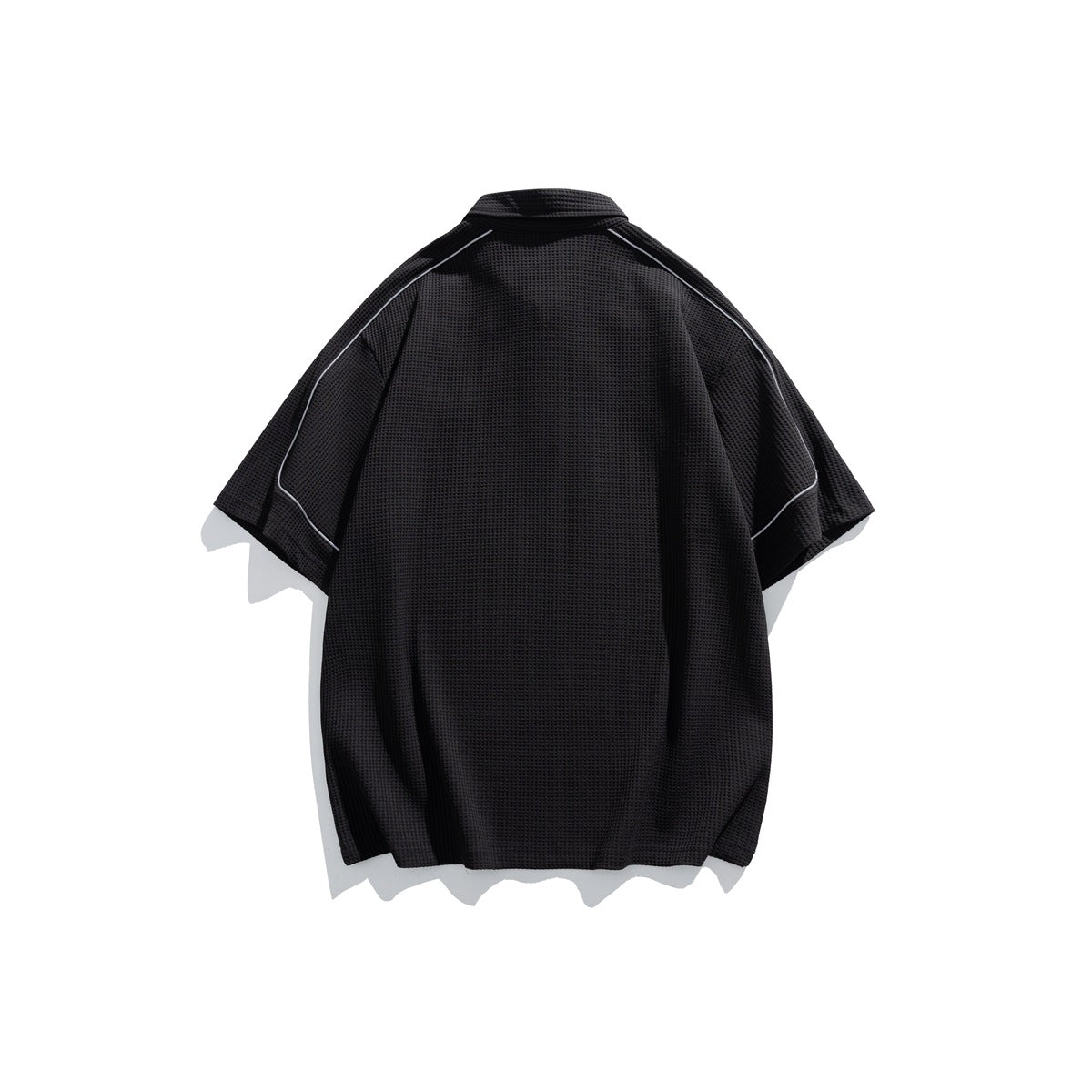 Back view of a black short-sleeve polo shirt with light contrast piping along the shoulders and sleeves.