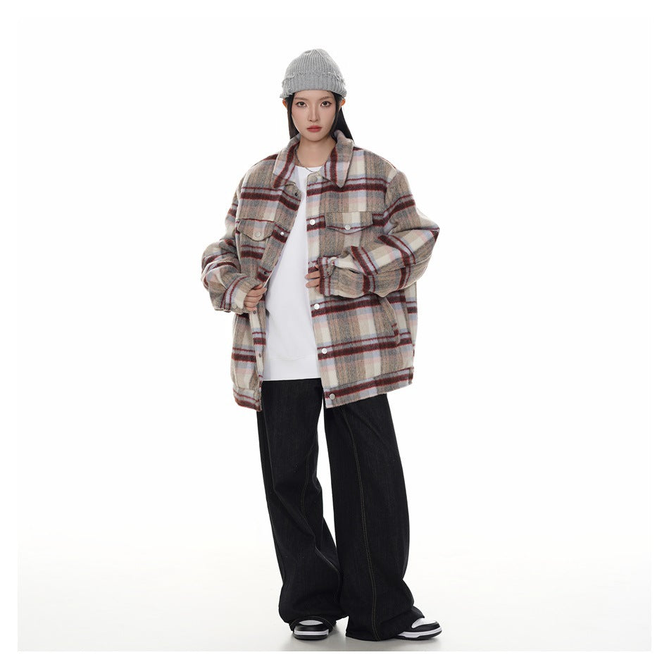 Full-length model wearing an oversized beige, gray, and burgundy plaid jacket with black wide-leg pants.
