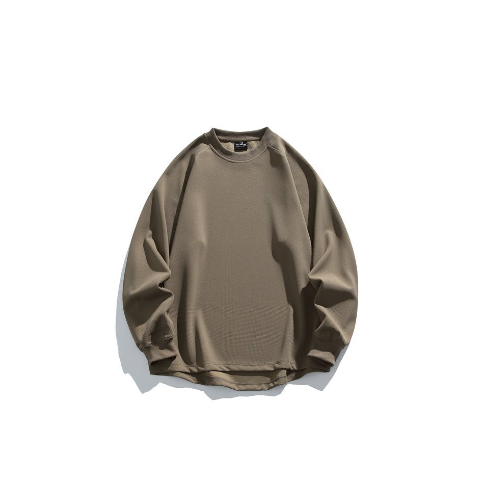 Brown waffle-knit crew neck sweatshirt with raglan sleeves, ribbed cuffs and curved hem, flat lay front view