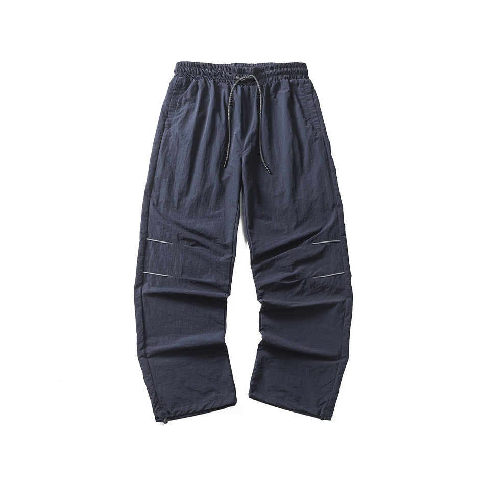 Navy wide-leg pants flat lay with drawstring waist, gray knee stripes and hem drawcords
