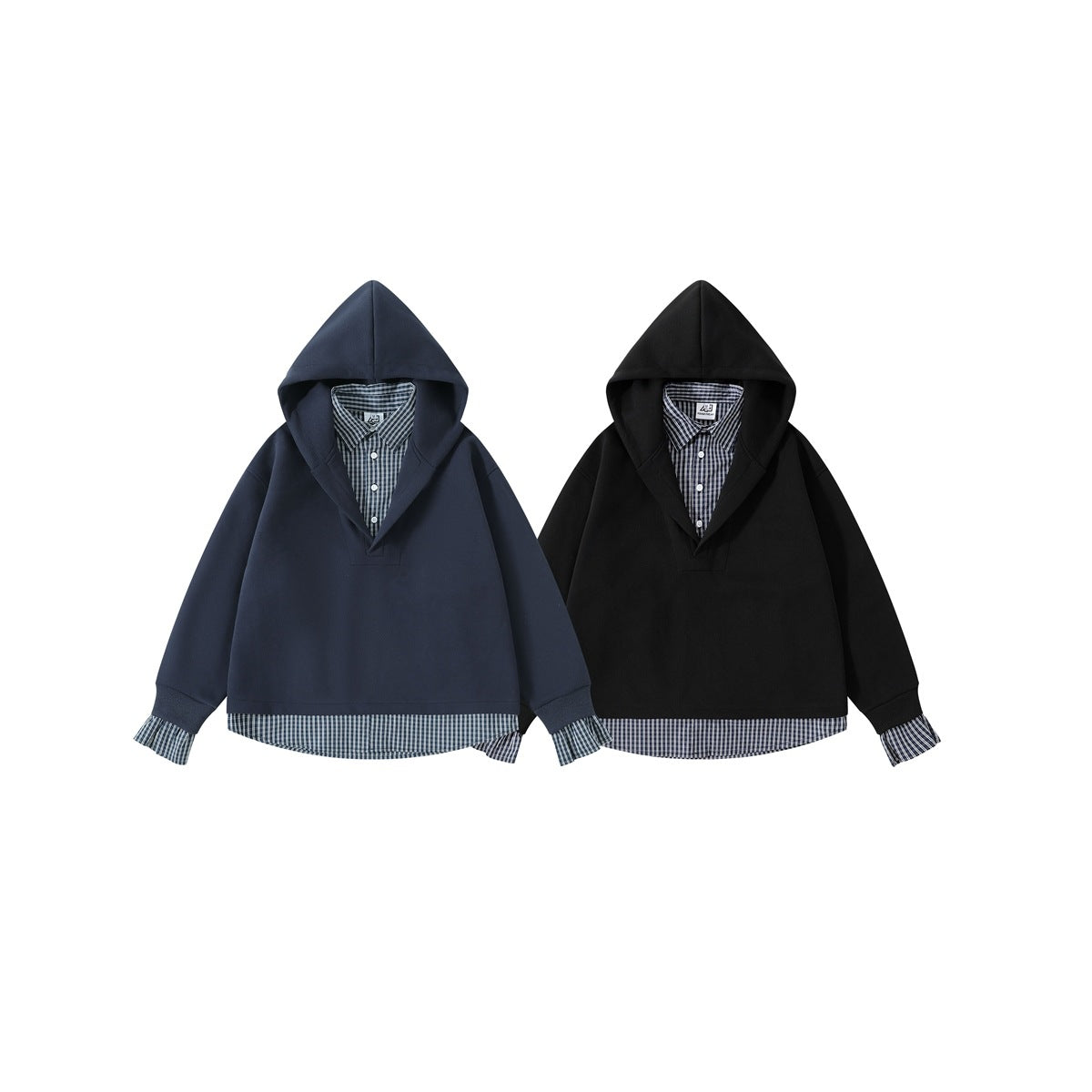 Two hooded pullovers, one navy and one black, each layered over a plaid shirt with the shirt hem and cuffs showing.