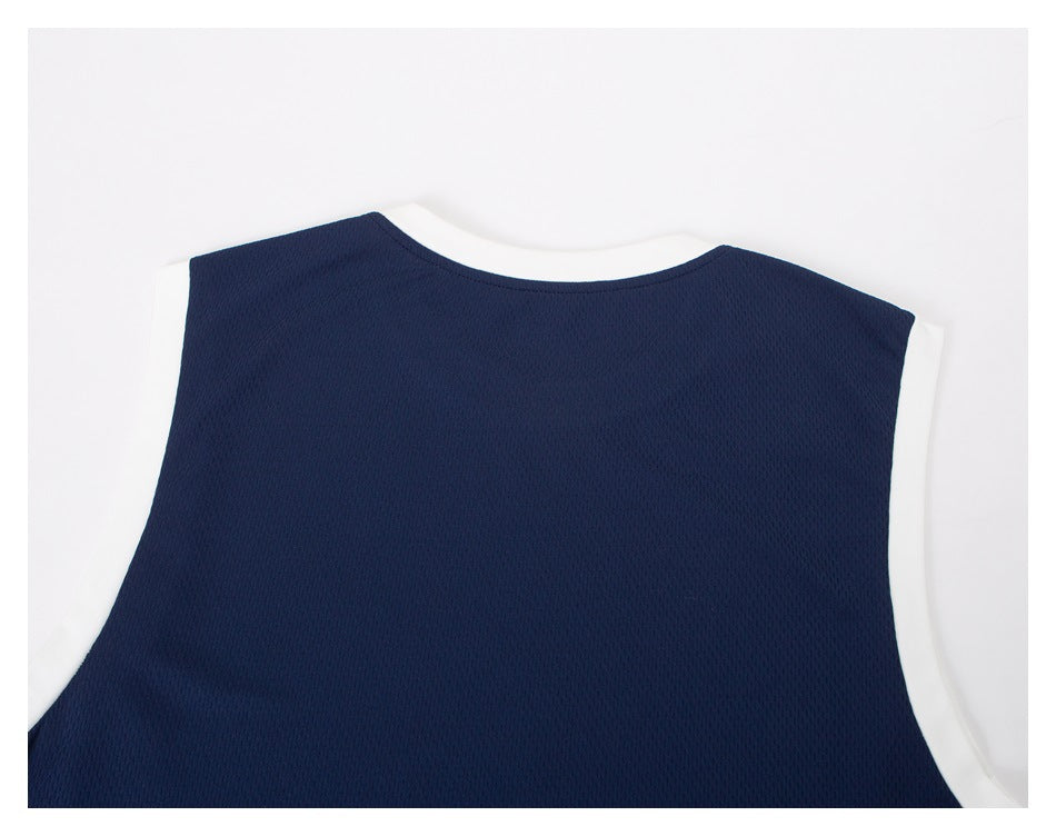 Close-up of the navy top's back with white trim around the neckline and armholes.