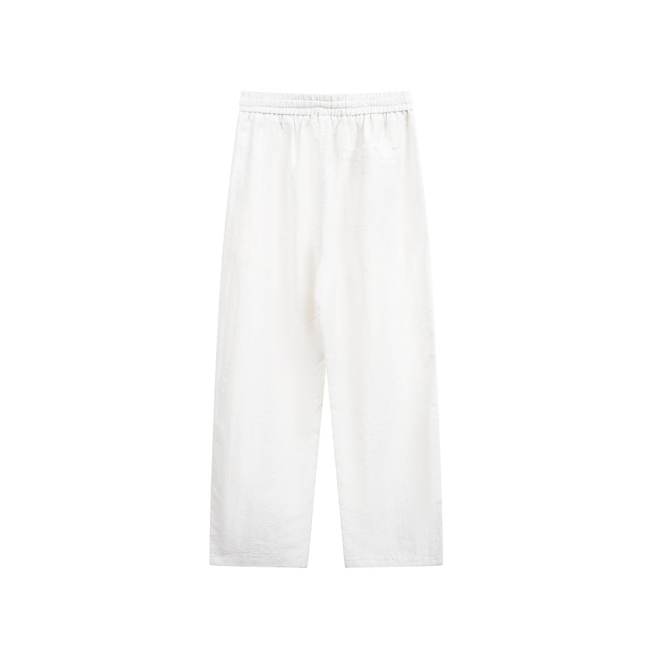 Off-white straight-leg pants with elastic waistband, back view