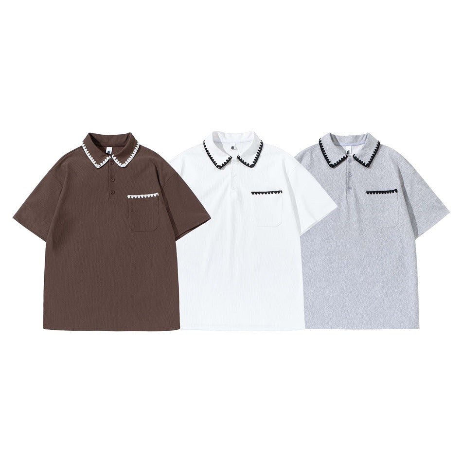 Three short-sleeve polo shirts shown from the front in brown, white, and light gray, each with black or white scalloped trim.